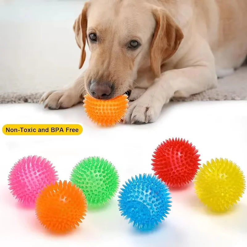 Durable squeaky spiked dog ball for teeth cleaning and play.